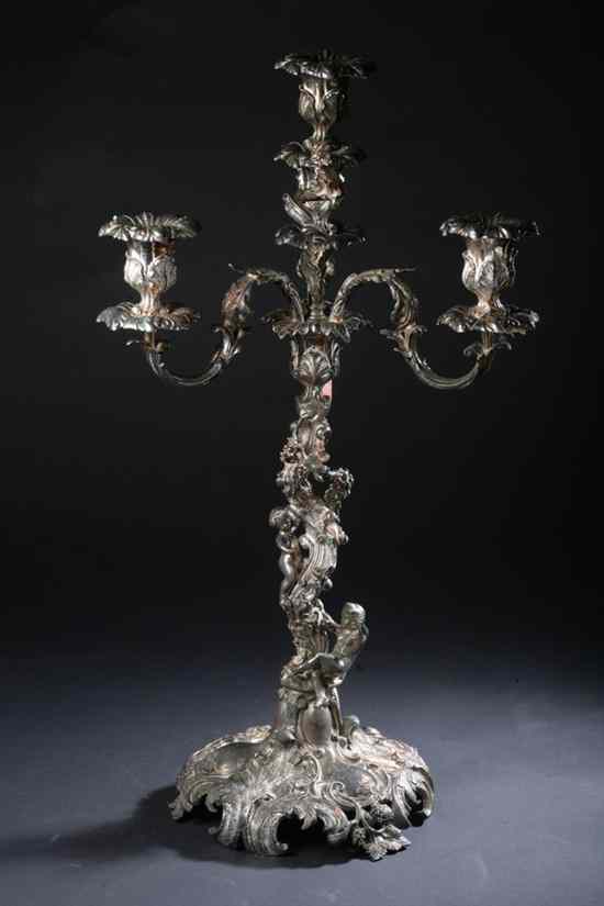 Appraisal: LARGE SILVER PLATED FOUR-LIGHT CANDELABRUM late th century Circular foot