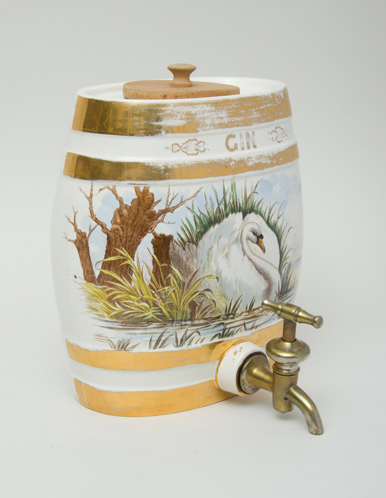 Appraisal: ENGLISH TRANSFER-PRINTED POTTERY LIQUOR DISPENSER WITH BRASS SPIGOT With overglaze