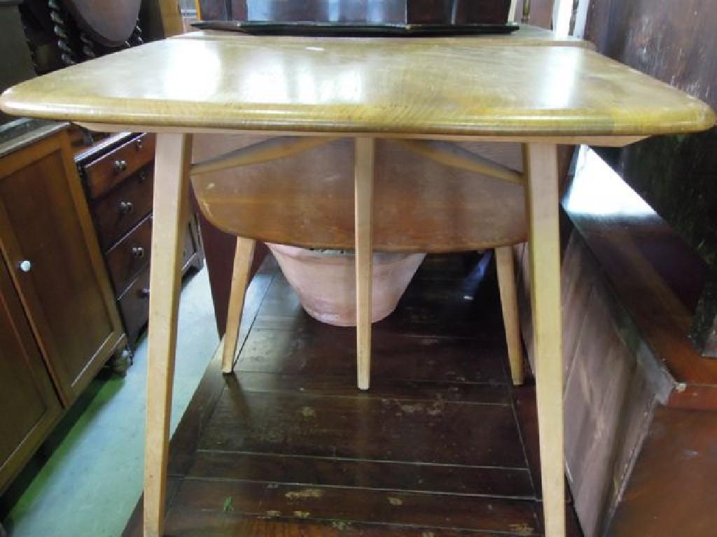 Appraisal: An Ercol elm and beechwood drop leaf kitchen table raised