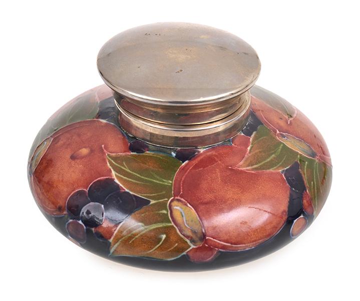 Appraisal: A WILLIAM MOORCROFT POMEGRANATE INKWELL CIRCA silver coated brass collar