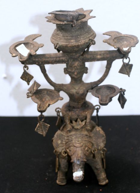 Appraisal: A Dokra oil lamp cast as an elephant and rider