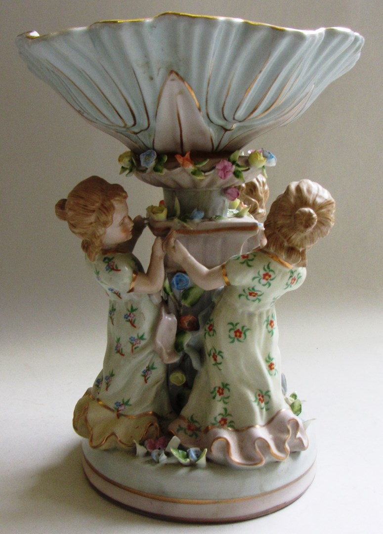 Appraisal: A German porcelain centrepiece early th century modelled with three