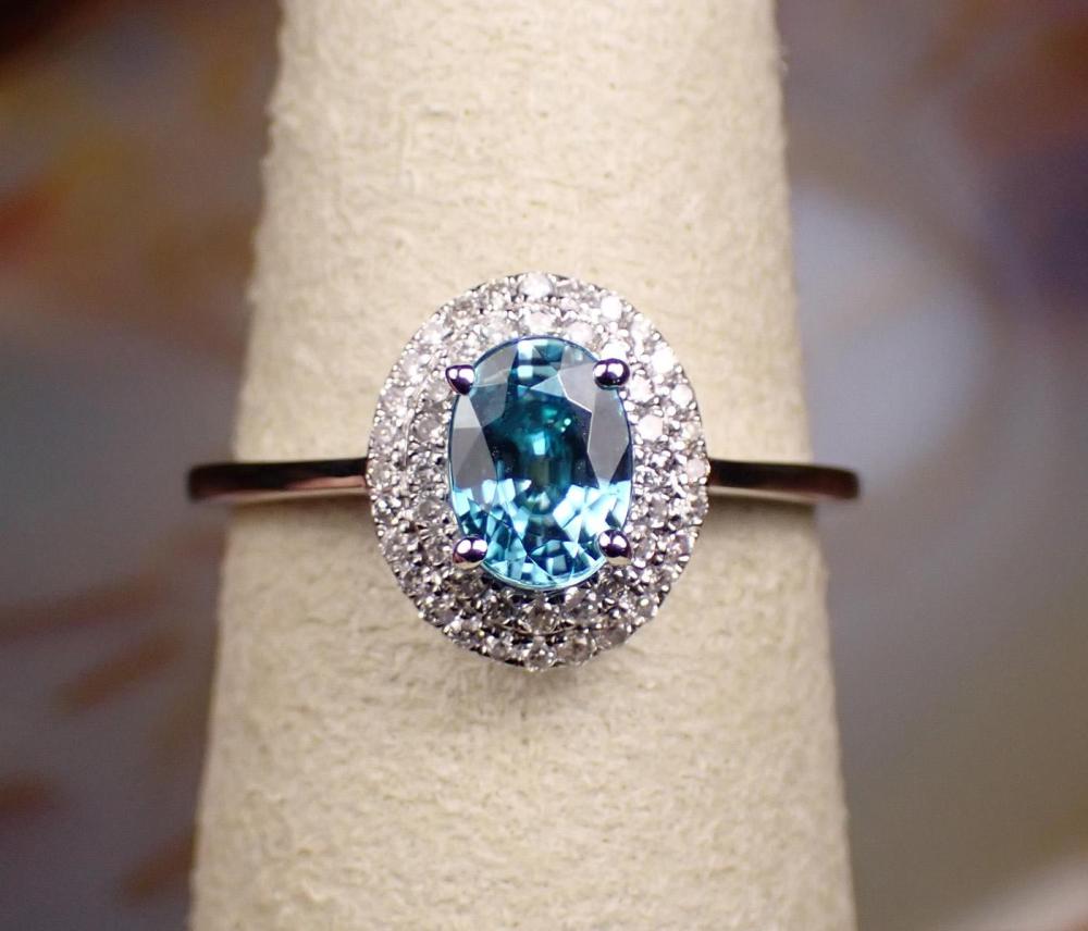 Appraisal: BLUE ZIRCON DIAMOND HALO AND FOURTEEN KARAT GOLD RING The