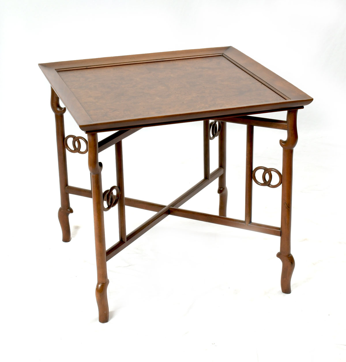 Appraisal: BAKER BURLWOOD OCCASIONAL TABLE Book match burlwood table raised on