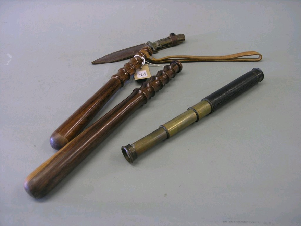 Appraisal: A leather mounted brass telescope four sections together with two