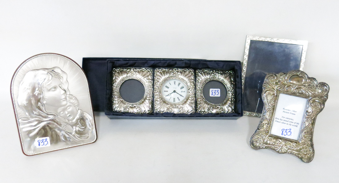 Appraisal: STERLING SILVER PICTURE FRAMES PLAQUE AND CLOCK WITH PHOTOS four