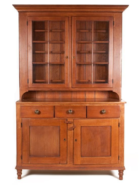 Appraisal: American Vernacular cherrywood glazed panel step-back cupboard Pennsylvania mid th