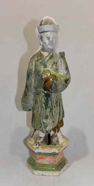 Appraisal: A CHINESE MING DYNASTY POTTERY AND GLAZED MALE FIGURE high