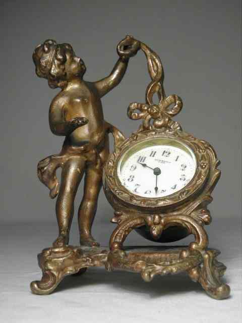 Appraisal: New Haven bronze finish novelty desk clock with cupid figural