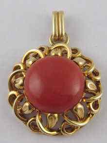 Appraisal: A yellow metal tests carat gold coral pendant the coral