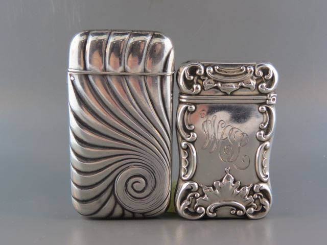 Appraisal: Sterling Silver Match Safes by Howard rococo and swirling largest