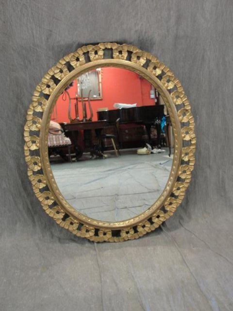 Appraisal: Giltwood and Carved Oval Mirror From a Riverdale estate Dimensions