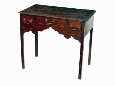 Appraisal: A George III oak side table the moulded edge top