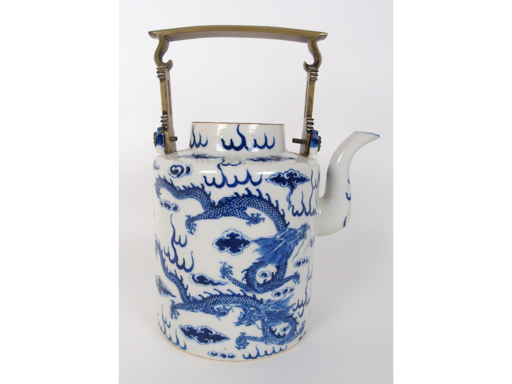 Appraisal: A Chinese blue and white tea kettlepainted with dragons amongst