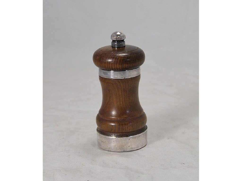 Appraisal: Hardwood teak capstan-style pepper mill with silver bands London