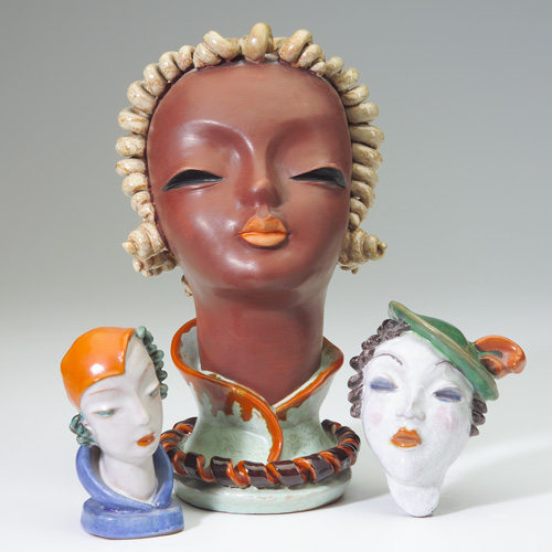 Appraisal: GOLDSCHEIDER Three ceramic female heads large one of a young