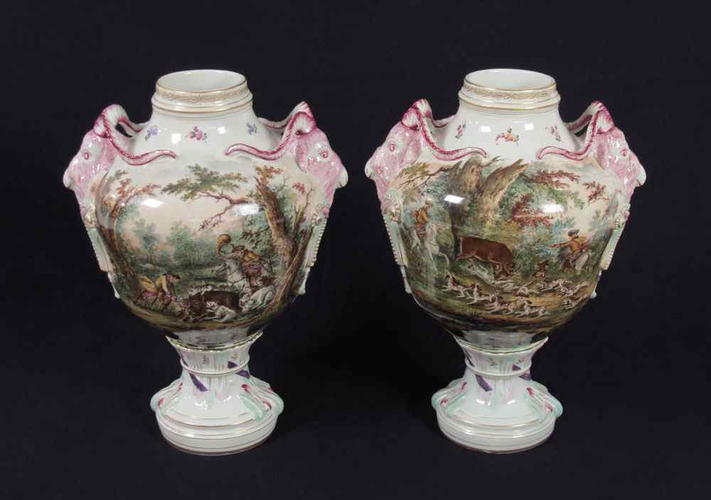 Appraisal: PAIR HAND PAINTED FINE GERMAN PORCELAIN URNS Hand painted hunt