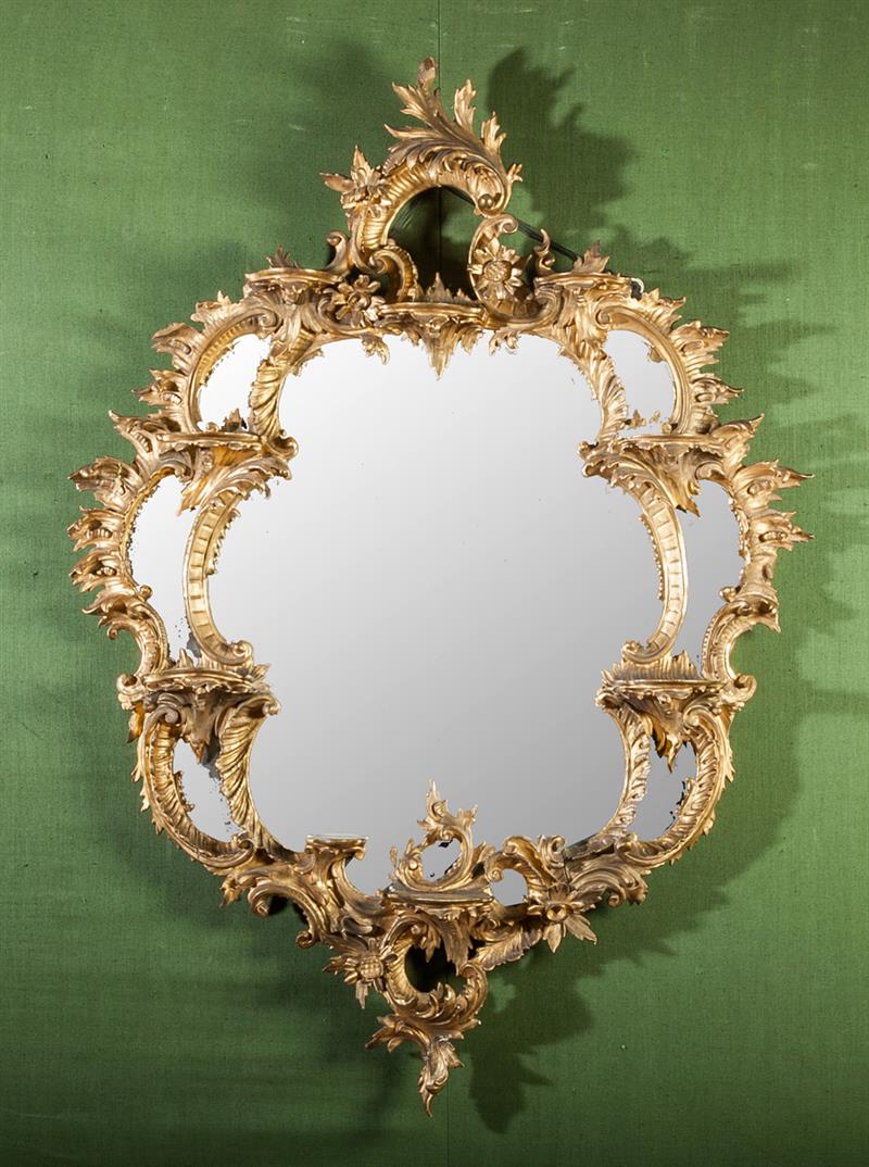 Appraisal: Chippendale Style Carved Giltwood Mirror The shell and foliate-carved frame