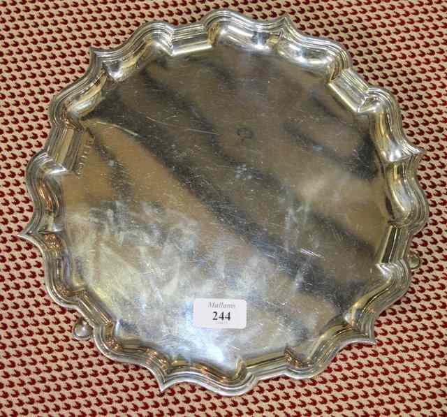 Appraisal: A SILVER SALVER of shaped circular form with raised pie-crust