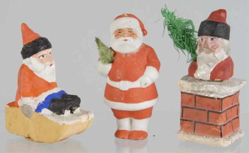 Appraisal: Lot of Small Santa Pieces Description Includes a Santa in