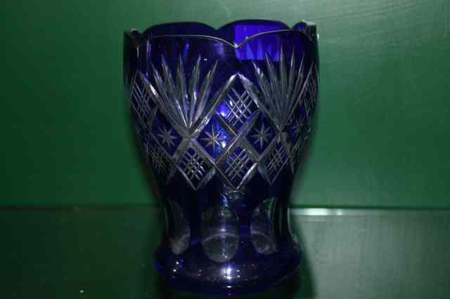 Appraisal: A BOHEMIAN BLUE OVERLAID GLASS VASE with star cut decoration