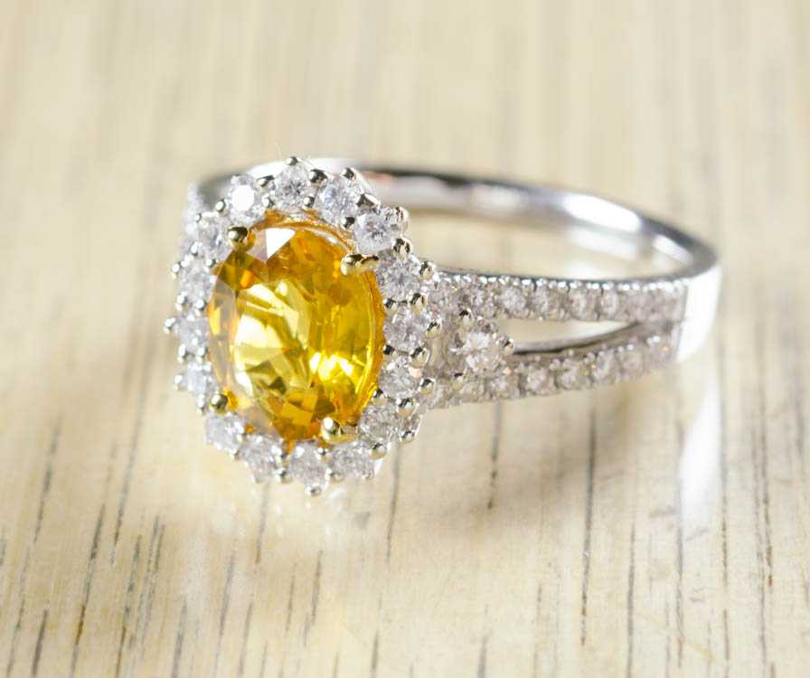 Appraisal: YELLOW SAPPHIRE AND FOURTEEN KARAT GOLD RING The white and