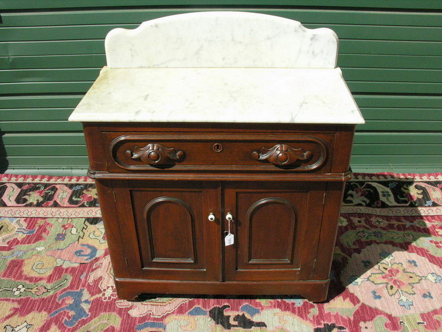 Appraisal: MARBLE TOP WALNUT WASHSTAND Walnut pulls circa 's On casters