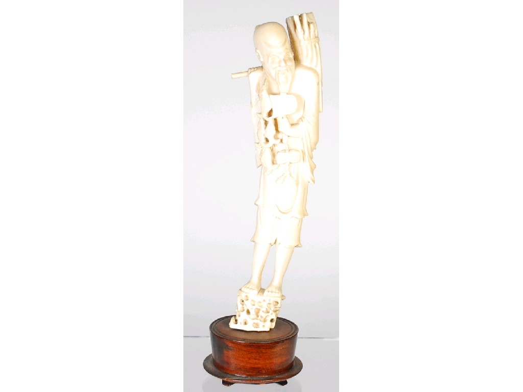 Appraisal: ORIENTAL CARVED ONE PIECE IVORY STANDING FIGURE OF A FISHERMAN