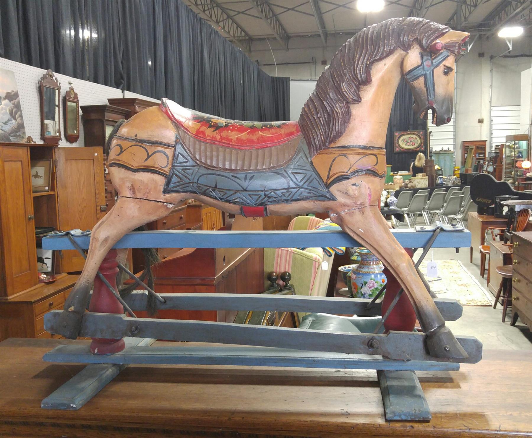 Appraisal: PAINTED ROCKING HORSE ON PLATFORM Twentieth century Freehand decoration in