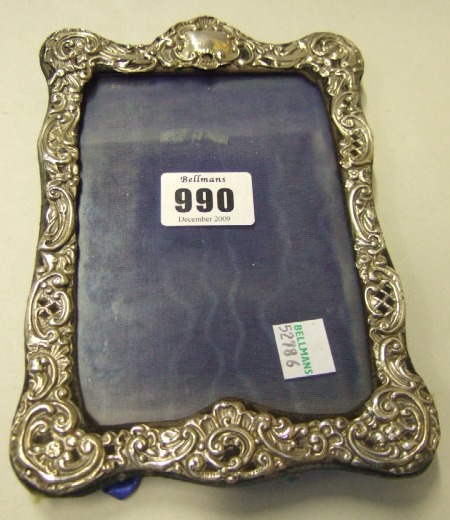 Appraisal: A silver mounted shaped rectangular photograph frame with pierced and