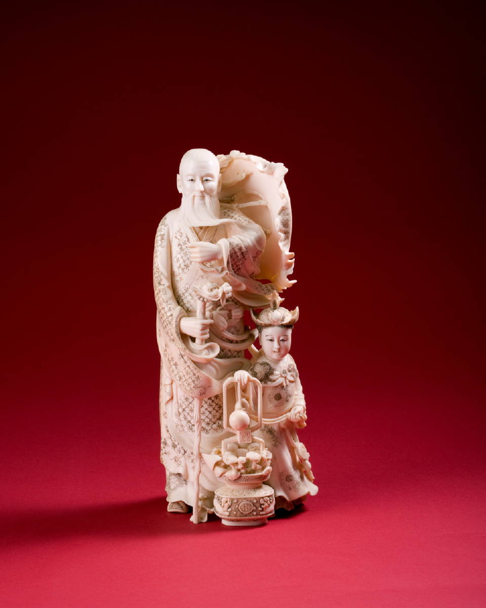 Appraisal: JAPANESE CARVED IVORY FIGURE OF A BEARDED MAN AND CHILD