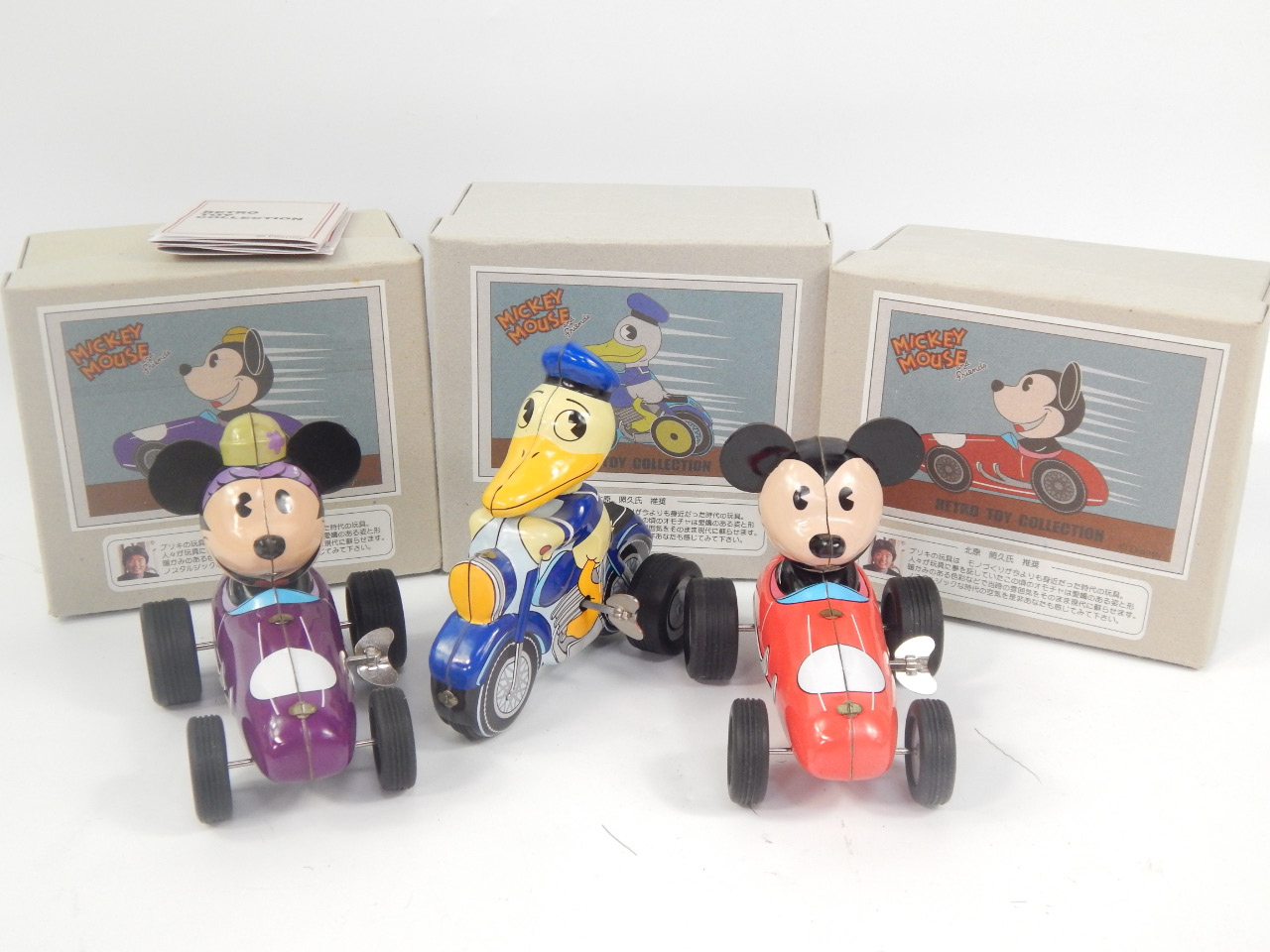 Appraisal: Three retro toy collection Disney characters comprising Mickey Mouse in