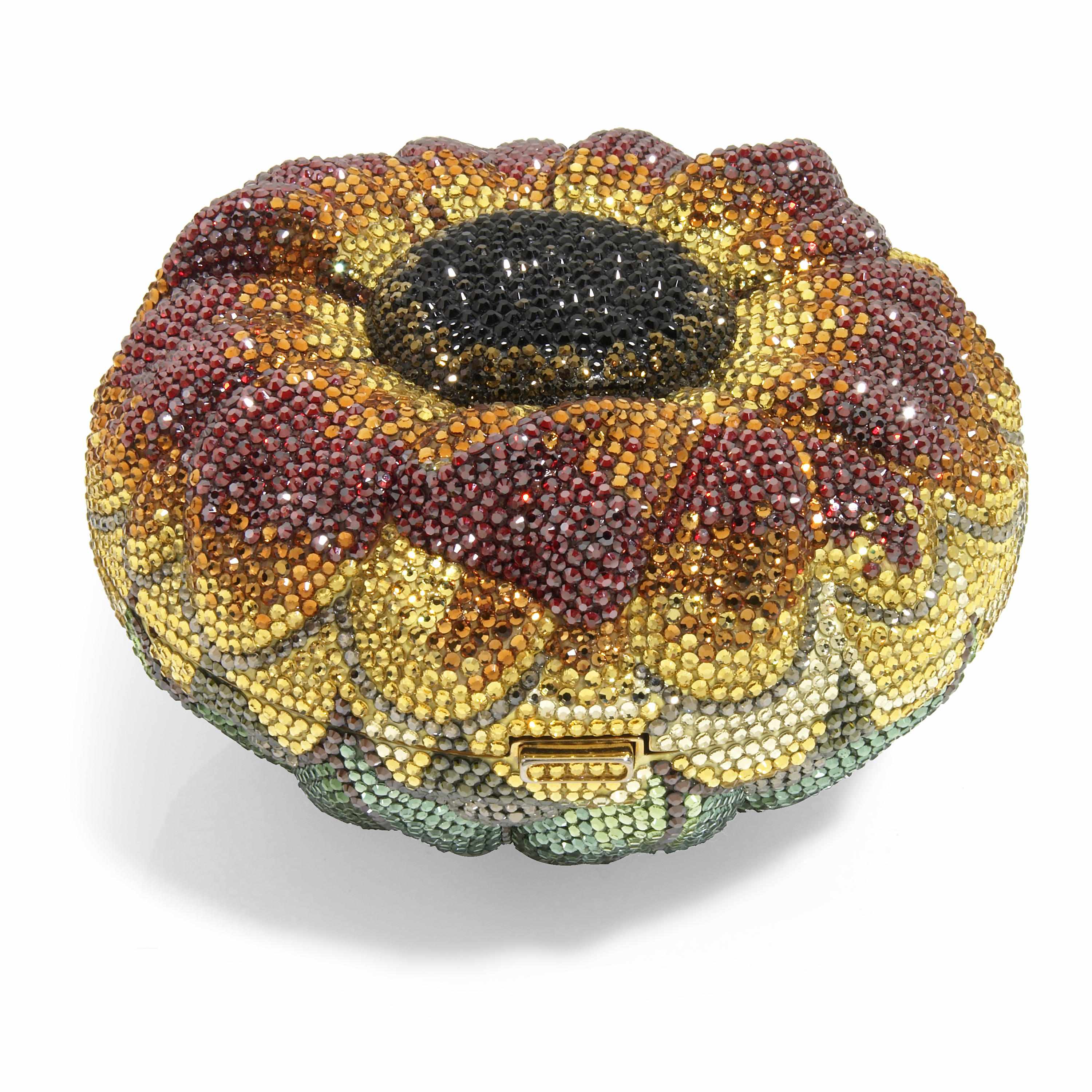 Appraisal: A multi-colored crystal sunflower minaudiere interior with a mirror signed