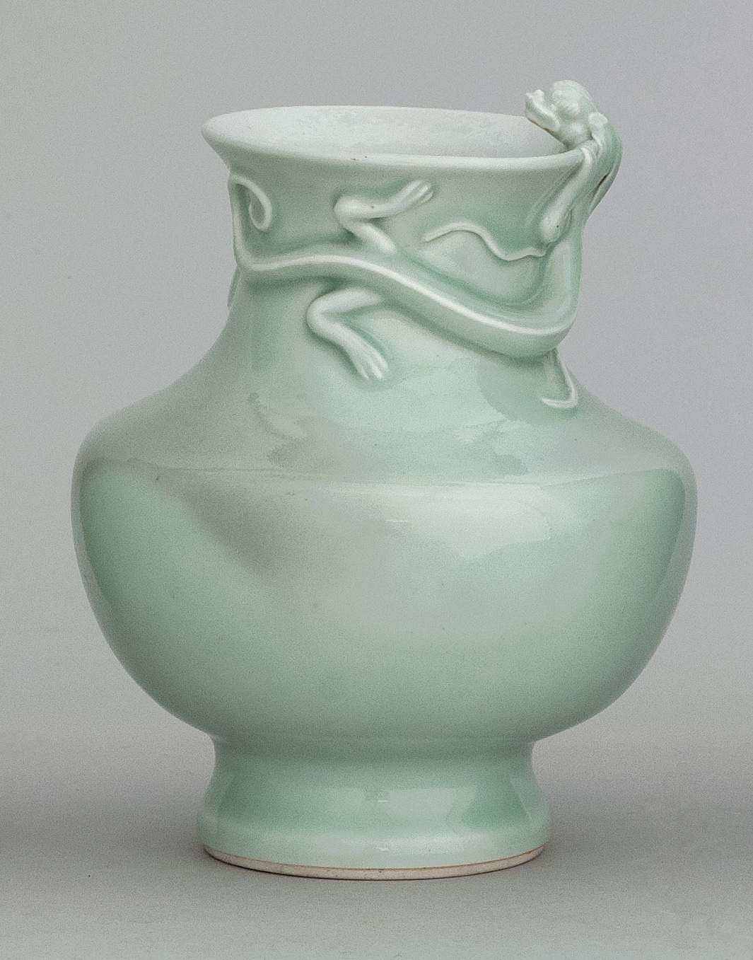 Appraisal: CELADON PORCELAIN VASE th th CenturyIn baluster form with high-relief