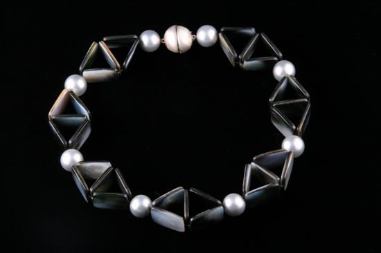 Appraisal: CONTEMPORARY MOTHER-OF-PEARL BEAD NECKLACE Created and designed by Sylvia Gottwald