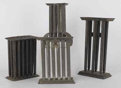 Appraisal: Four tin candlemolds th c tallest -