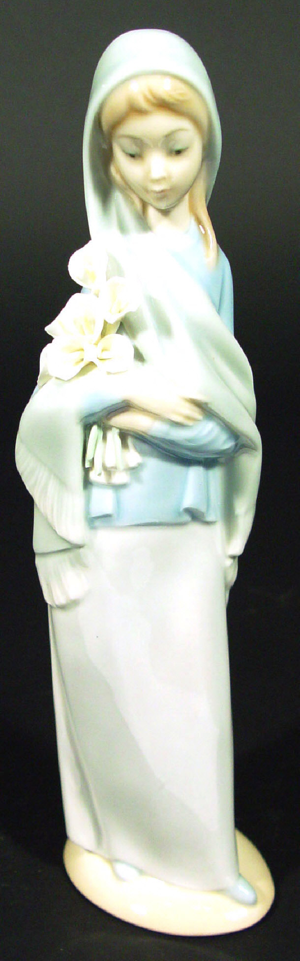 Appraisal: Lladro porcelain figurine clutching lilies printed factory mark to the