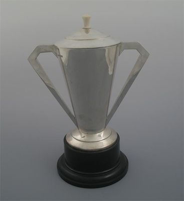 Appraisal: A modern Colonial trophy cup and cover with ivory finial