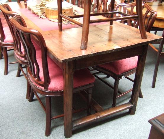 Appraisal: An early th century French cherrywood farmhouse table the four