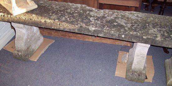 Appraisal: A rustic stone bench on shaped supports cm wide