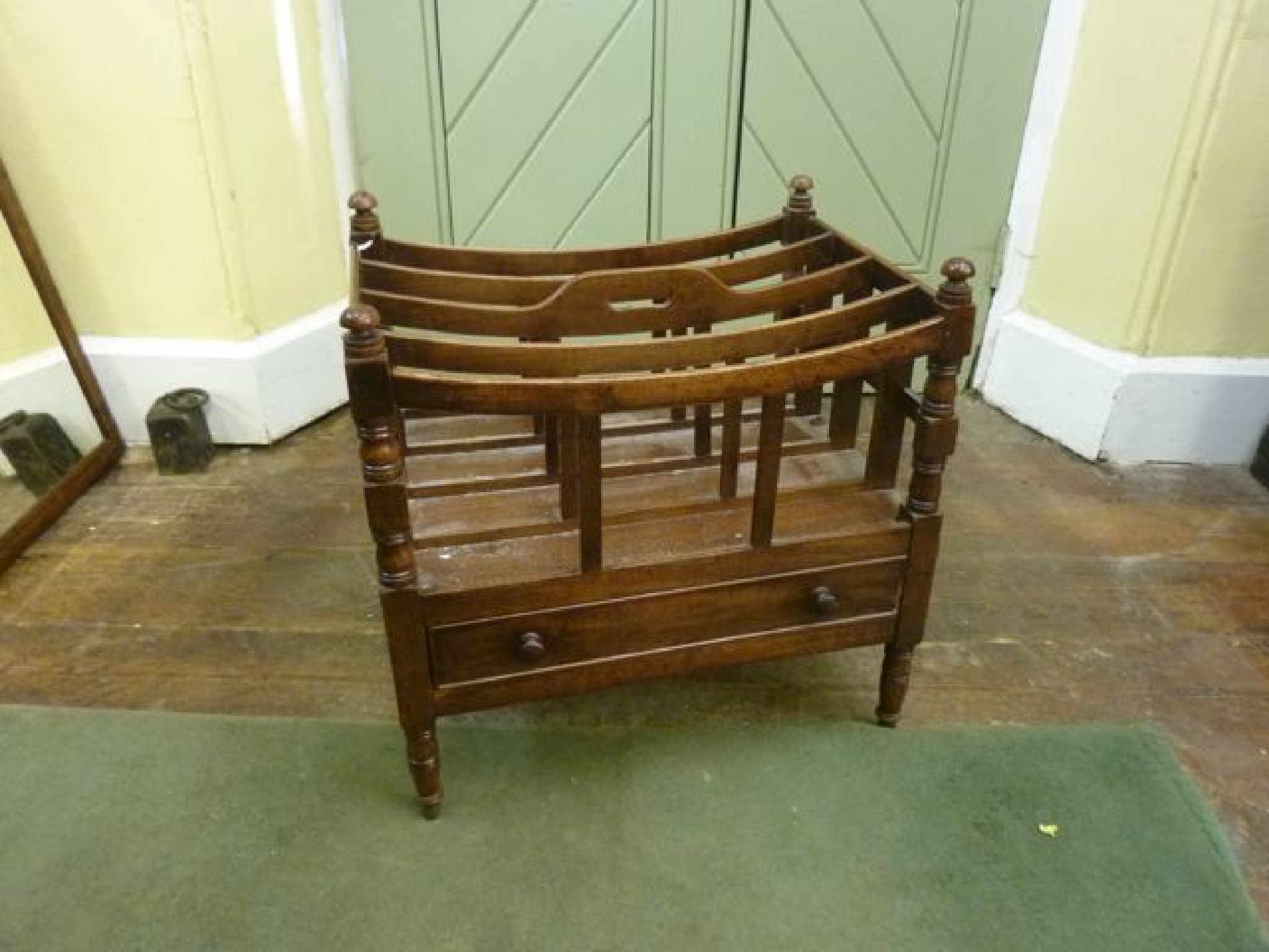 Appraisal: A Georgian mahogany four divisional Canterbury with concave rails over