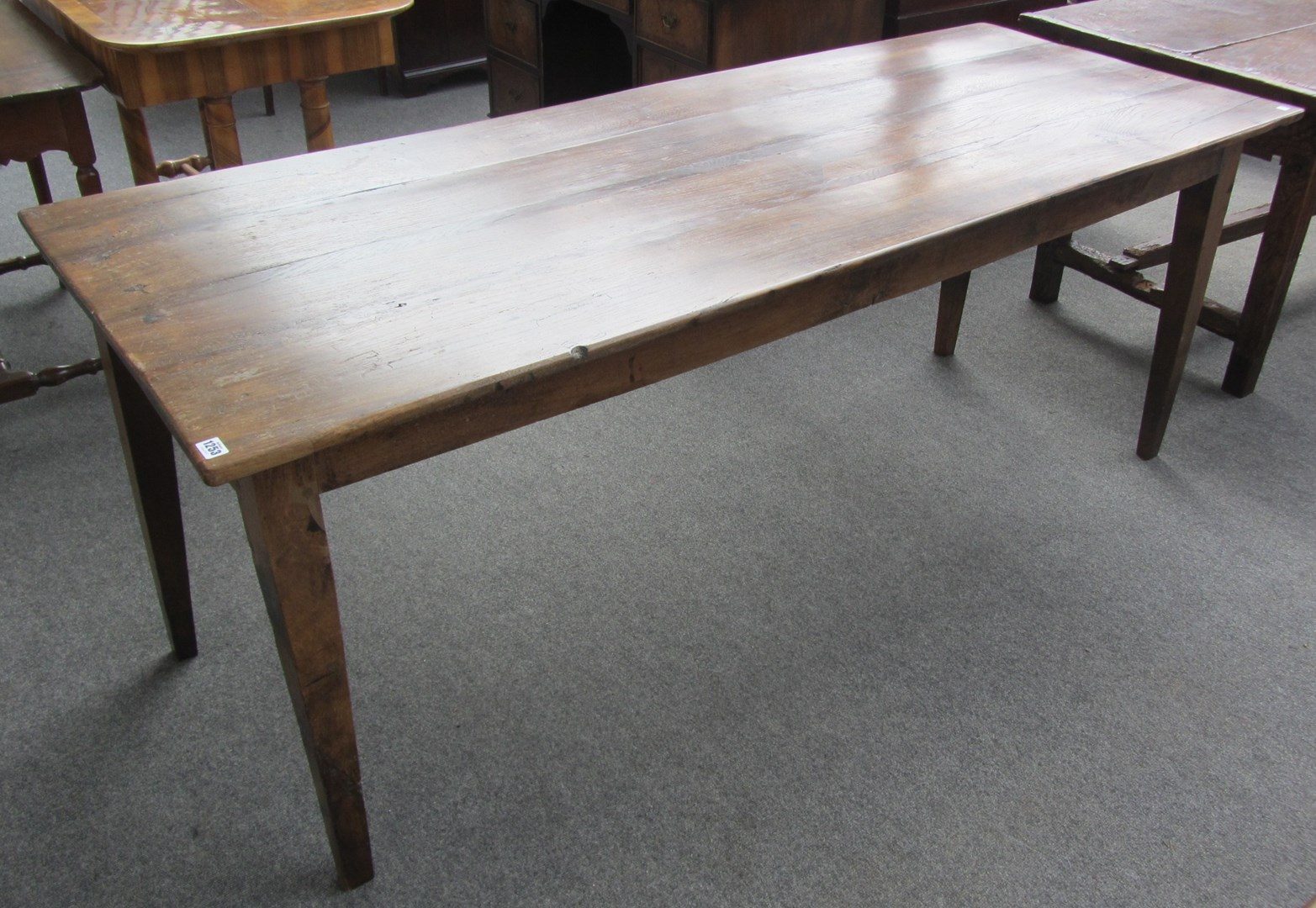 Appraisal: A th century French rectangular oak farmhouse table on tapering