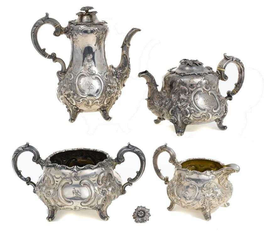 Appraisal: A VICTORIAN TEA AND COFFEE SERVICE of ogee shape and