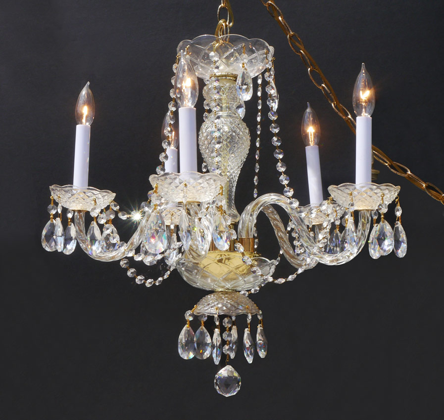 Appraisal: CRYSTAL GLASS ARM CHANDELIER Cut and pressed glass on brass