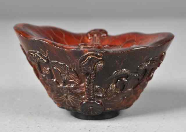 Appraisal: A Chinese Carved Horn Libation VesselFinely carved to depict cranes