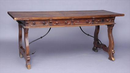 Appraisal: ITALIAN BAROQUE WALNUT CENTER TABLE The rectangular top above two