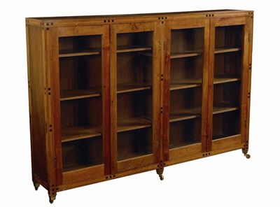 Appraisal: An Arts Crafts walnut bookcase with ebonised cube parquetry inlay