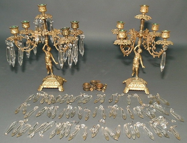 Appraisal: Pair of cast metal candelabra with drop prisms and gilt