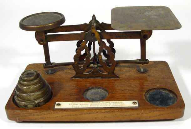 Appraisal: Set of brass postal scales and weights with engraved pan