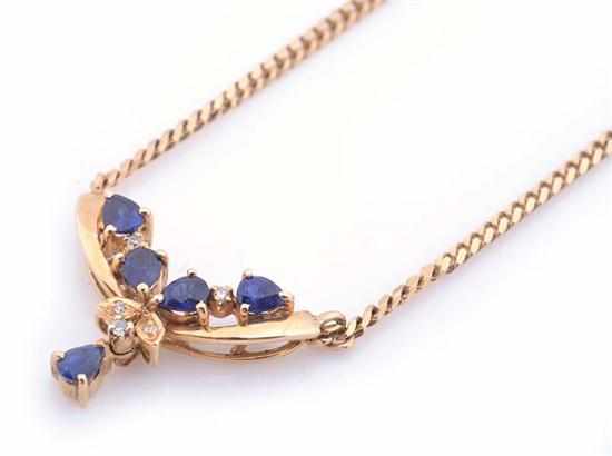 Appraisal: A SAPPHIRE AND DIAMOND PENDANT NECKLACE IN CT GOLD